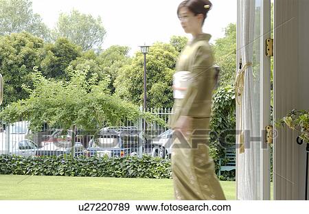 Portrait of a young woman in kimono, blurred motion View Large Photo Image Stock Photo - Portrait of a young woman in kimono, blurred motion. Fotosearch