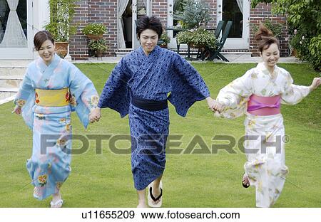 Stock Photo - Three people in kimono running. Fotosearch