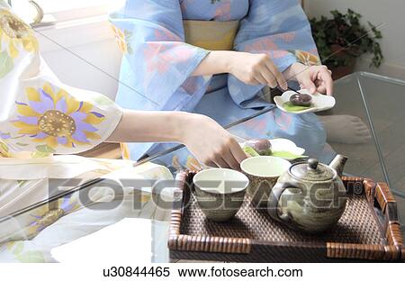Two women eating Japanese sweets View Large Photo Image Stock Photography - Two women eating Japanese sweets. Fotosearch