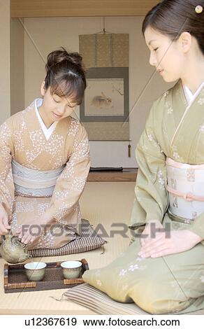 Two women in kimono serving tea View Large Photo Image Stock Photo - Two women in kimono serving tea. Fotosearch