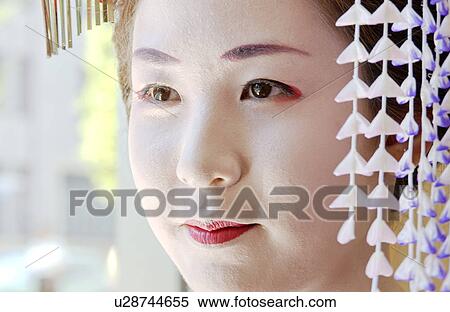 Stock Photography - A Geisha woman, close-up. Fotosearch