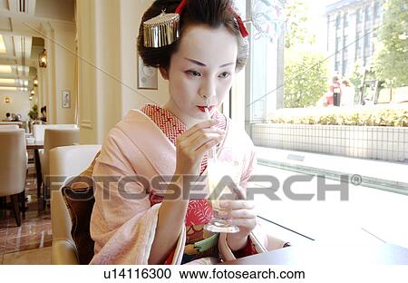 A Geisha woman drinking juice View Large Photo Image Stock Image - A Geisha woman drinking juice. Fotosearch