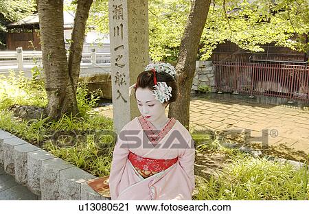 A Geisha woman sitting View Large Photo Image Stock Image - A Geisha woman sitting. Fotosearch