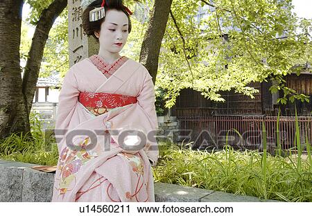 A Geisha woman sitting View Large Photo Image Stock Image - A Geisha woman sitting. Fotosearch