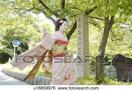 A Geisha woman smiling, blurred motion View Large Photo Image Stock Photograph - A Geisha woman smiling, blurred motion. Fotosearch
