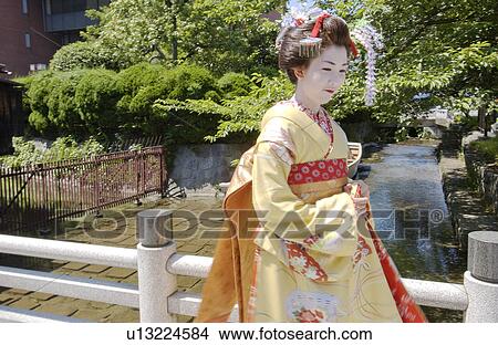 Picture - A Geisha woman smiling. Fotosearch