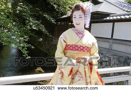 A Geisha woman smiling View Large Photo Image Stock Image - A Geisha woman smiling. Fotosearch