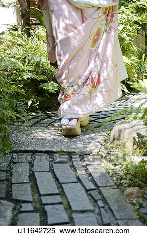 Stock Photography - A Geisha woman walking. Fotosearch