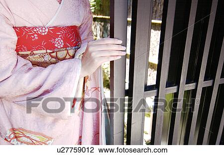 Close-up of a Geisha woman opening a door View Large Photo Image Stock Image - Close-up of a Geisha woman opening a door. Fotosearch