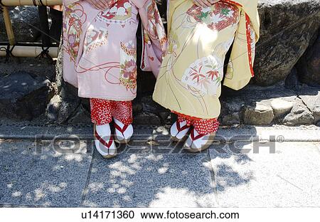 Stock Image - Low section of two Geisha women . Fotosearch