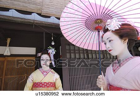 Stock Image - Portrait of two Geisha women. Fotosearch