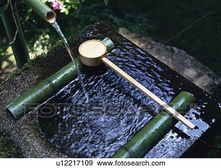 Purifying water in a temple View Large Photo Image Stock Photo - Purifying water in a temple. Fotosearch
