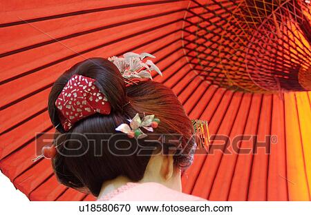 Stock Image - Rear view of a geisha woman. Fotosearch