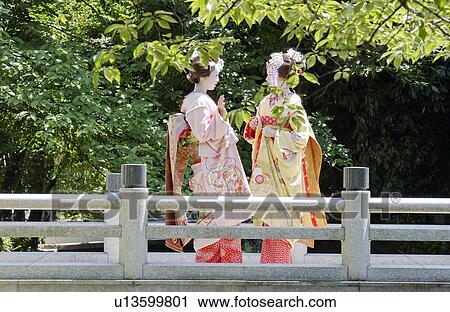 Two geisha women talking View Large Photo Image Stock Image - Two geisha women talking . Fotosearch