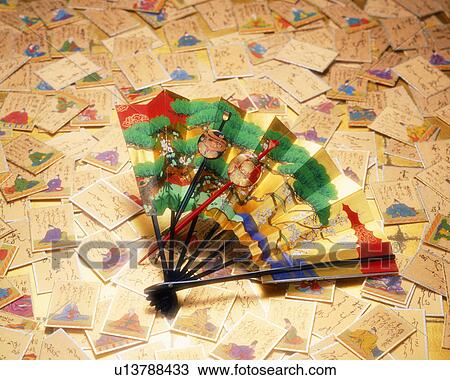 Stock Image - Cards and folding fan. Fotosearch