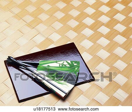 Folding fan on a tray View Large Photo Image Stock Image - Folding fan on a tray. Fotosearch