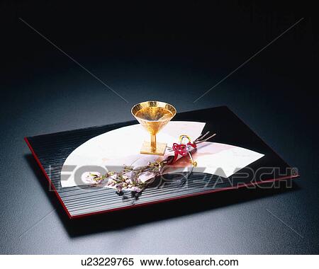 Golden sake cup on a tray View Large Photo Image Stock Photography - Golden sake cup on a tray. Fotosearch