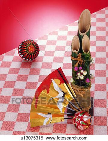 Stock Photography - New Year's decoration and folding fan. Fotosearch