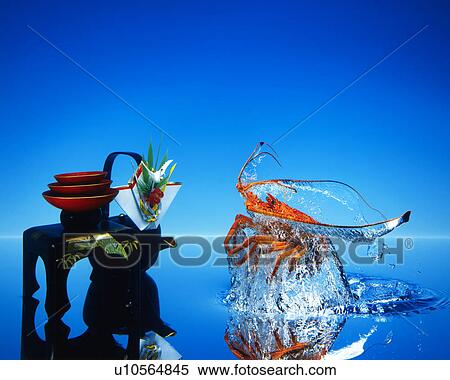 Stock Photography - Prawn and lacquered sake cups. Fotosearch