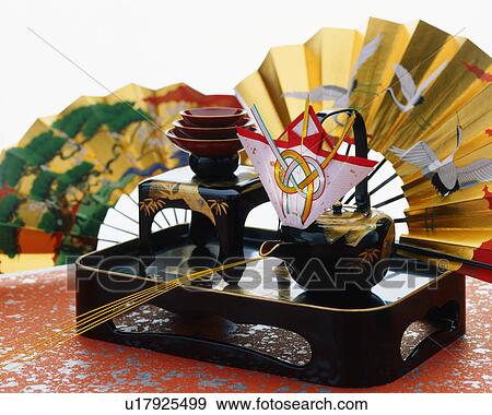 Stock Photo - Sake cups and folding fans. Fotosearch