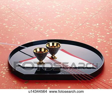 Picture - Sake cups on a tray. Fotosearch