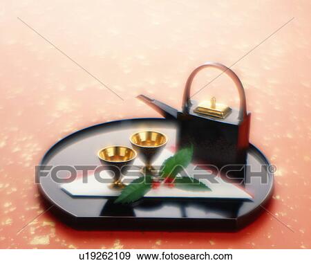 Stock Photo - Sake pot and cups on a tray. Fotosearch