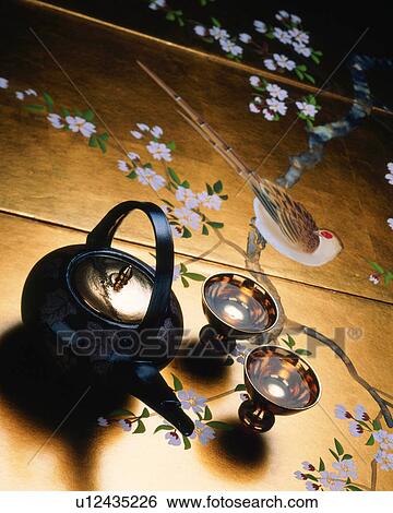 Stock Photograph - Sake pot and cups. Fotosearch