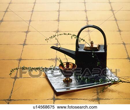Stock Photography - Sake pot and golden cup. Fotosearch