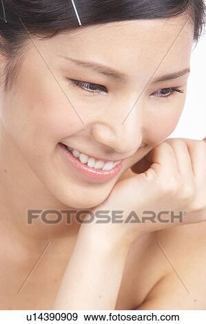 Portrait of Natural Young girl with hands next to face View Large Photo Image Stock Photo - Portrait of Natural Young girl with hands next to face. Fotosearch