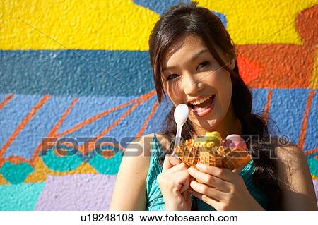 Young Lady Eating Ice-Cream View Large Photo Image Stock Photo - Young Lady Eating Ice-Cream. Fotosearch