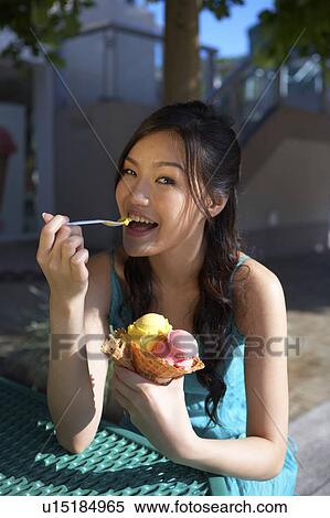 Young Lady Eating Ice-Cream View Large Photo Image Stock Photography - Young Lady Eating Ice-Cream. Fotosearch