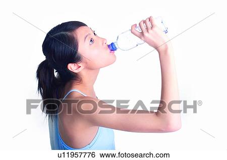 Young woman drinking water, close-up View Large Photo Image Stock Photograph - Young woman drinking water, close-up. Fotosearch