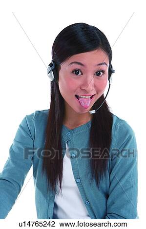 Young woman wearing headphone and making a face View Large Photo Image Stock Image - Young woman wearing headphone and making a face. Fotosearch