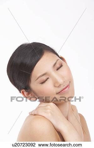 Portrait of Natural Young girl touching shoulder, Eyes Closed View Large Photo Image Stock Image - Portrait of Natural Young girl touching shoulder, Eyes Closed. Fotosearch