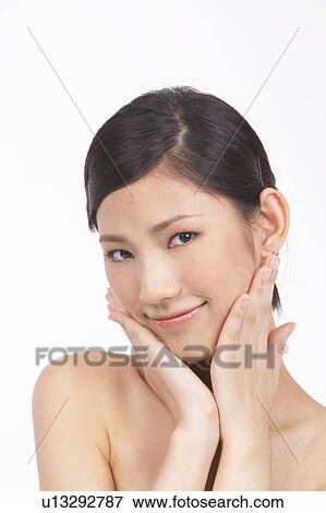 Portrait of Natural Young girl touching face View Large Photo Image Stock Photo - Portrait of Natural Young girl touching face. Fotosearch