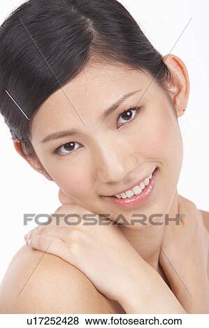Portrait of Natural Young girl touching shoulder View Large Photo Image Stock Photo - Portrait of Natural Young girl touching shoulder. Fotosearch