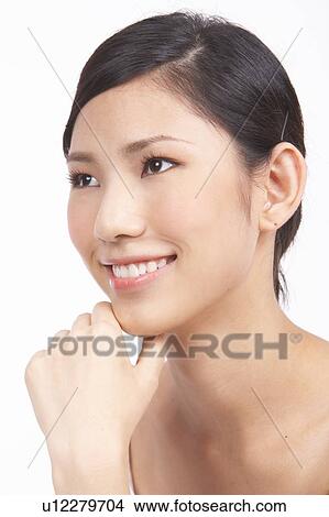 Picture - Portrait of Natural Young girl with hands next to face. Fotosearch