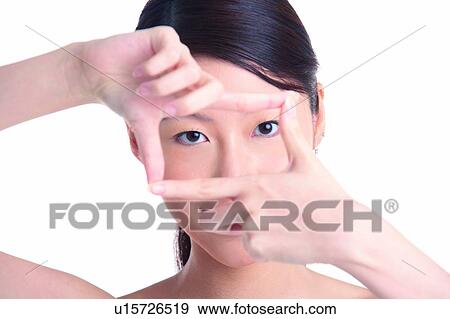 Young girl forming rectangle with fingers View Large Photo Image Stock Photo - Young girl forming rectangle with fingers. Fotosearch