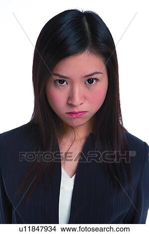Young woman in business suit, angry, close up View Large Photo Image Picture - Young woman in business suit, angry, close up. Fotosearch