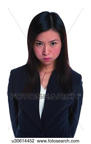 Stock Image - Young woman in business suit, angry. Fotosearch