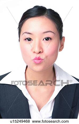 Young woman in business suit, pouting lips, close-up View Large Photo Image Stock Photo - Young woman in business suit, pouting lips, close-up. Fotosearch