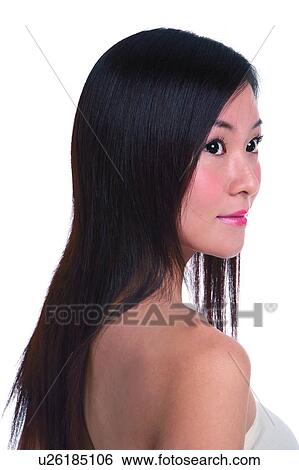 Young woman smiling, turning head, side view, close-up View Large Photo Image Stock Photograph - Young woman smiling, turning head, side view, close-up. Fotosearch