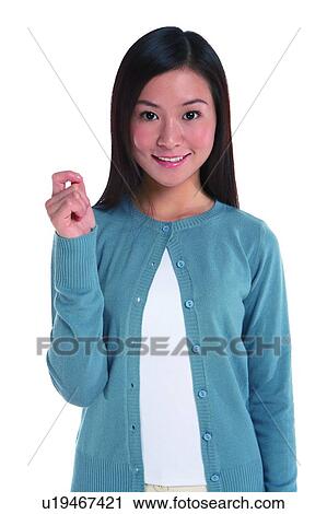 Young woman standing, in a gesture of knocking View Large Photo Image Stock Image - Young woman standing, in a gesture of knocking. Fotosearch
