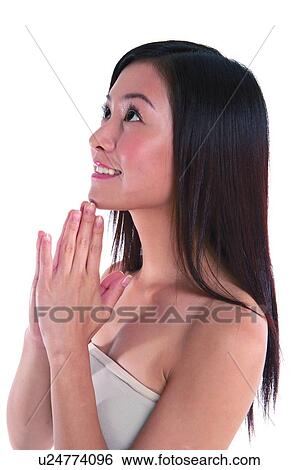 Young woman standing, smiling, close-up View Large Photo Image Stock Photograph - Young woman standing, smiling, close-up. Fotosearch