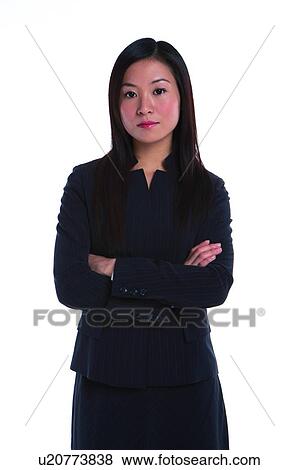 Young woman in business suit, discontent, standing in confidence, front view View Large Photo Image Stock Photo - Young woman in business suit, discontent, standing in confidence, front view. Fotosearch