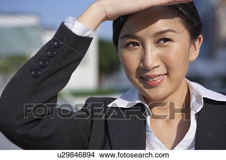 Picture - Young Businesswoman Observing. Fotosearch