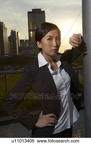 Young Businesswoman Standing in Street View Large Photo Image Stock Photography - Young Businesswoman Standing in Street. Fotosearch