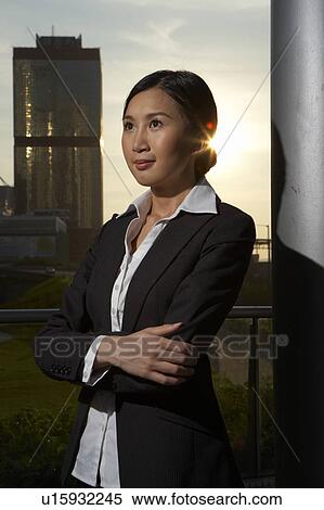 Young Businesswoman Standing in Street, Looking Away View Large Photo Image Stock Photography - Young Businesswoman Standing in Street, Looking Away. Fotosearch