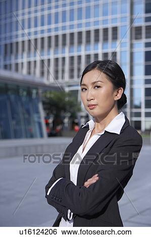 Stock Photograph - Young Busineswoman Standing in Street. Fotosearch