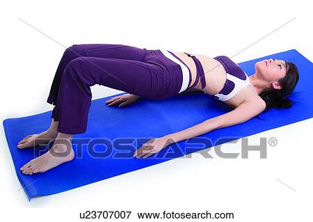 Young woman doing upward facing bow, yoga pose View Large Photo Image Stock Photo - Young woman doing upward facing bow, yoga pose. Fotosearch